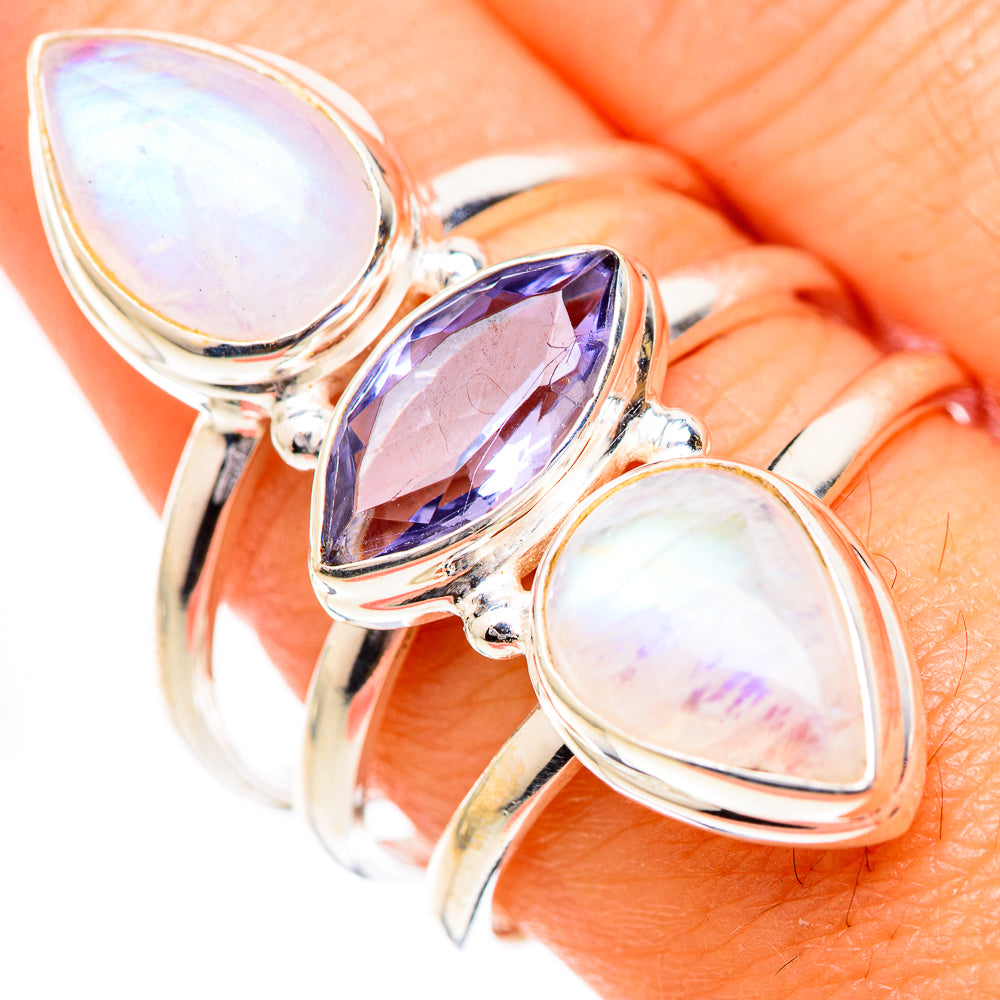 925 sterling silver ring with iridescent pear moonstones and a faceted purple center stone