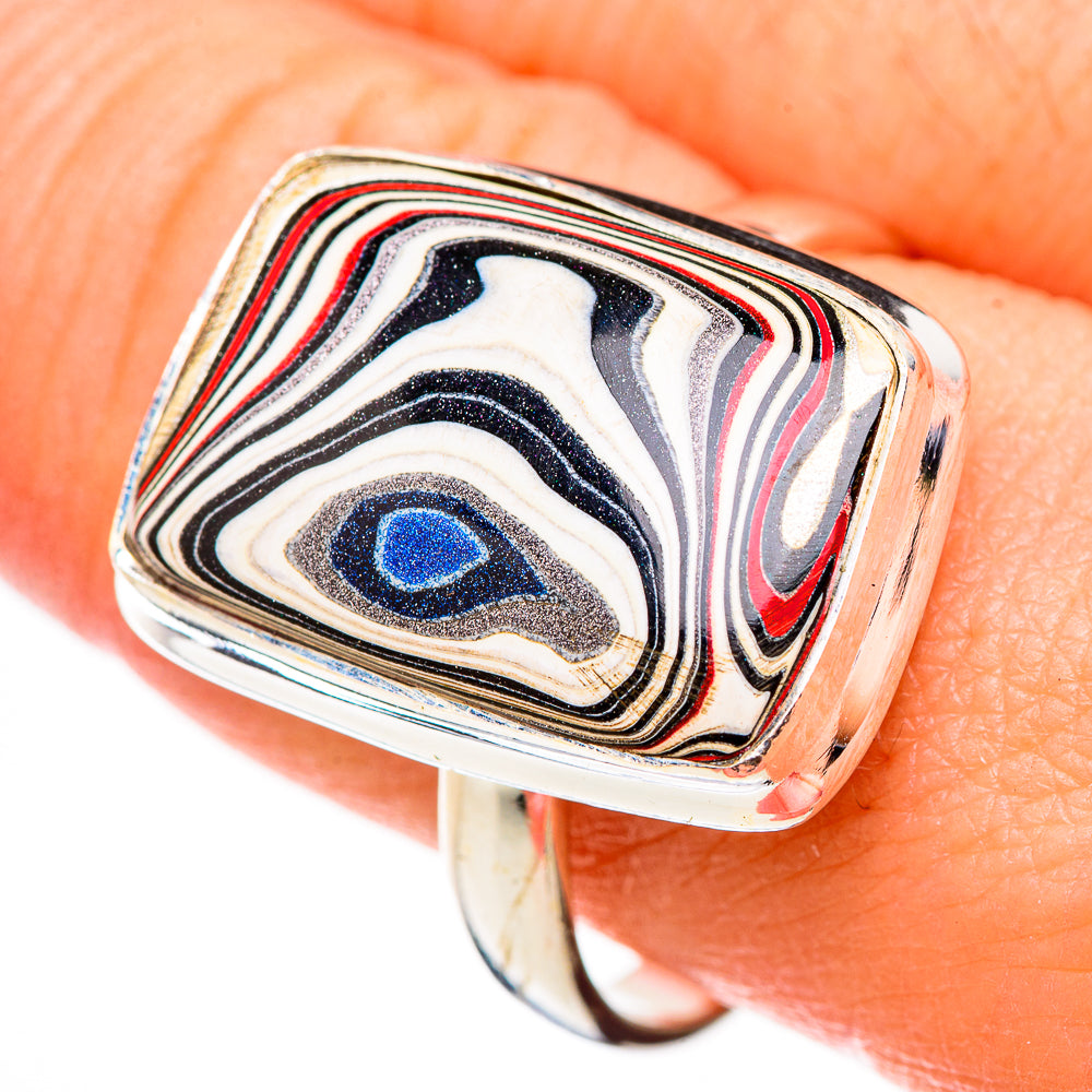Sterling silver square-face ring with blue center stripe pattern, close-up on hand