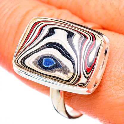 Sterling silver square-face ring with blue center stripe pattern, close-up on hand