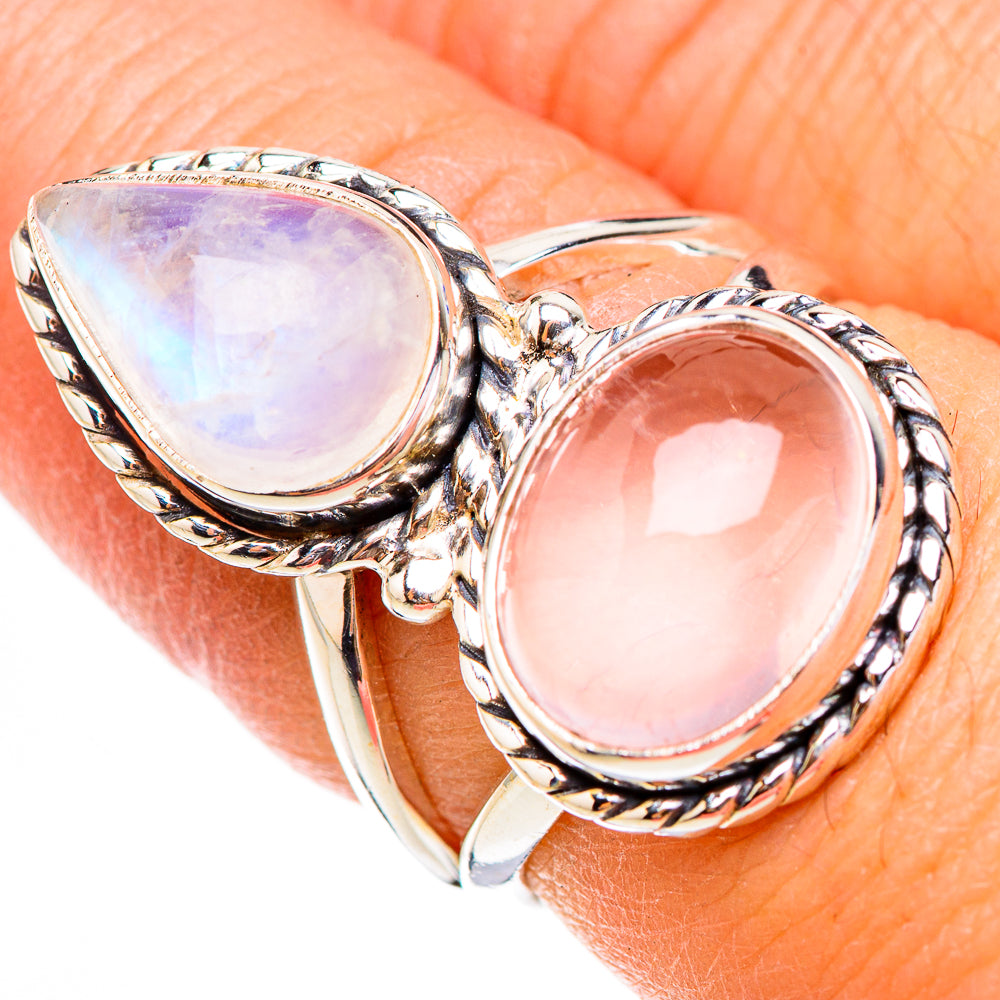 Two-stone sterling silver ring with pink and iridescent teardrop gemstones, openwork prongs