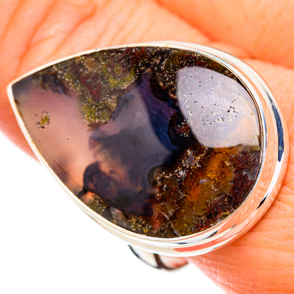 Plume agate ring close-up, 925 sterling silver bezel; dark stone with amber and green sparkles