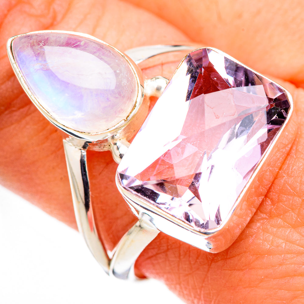 Sterling silver ring closeup, iridescent teardrop stone with large faceted pink-violet gem