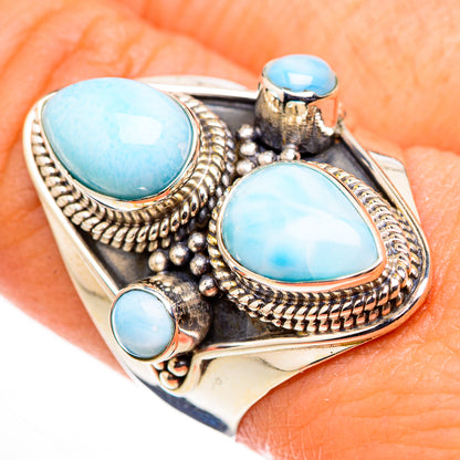 Sterling silver ring with three oval light-blue larimar cabochons and rope borders