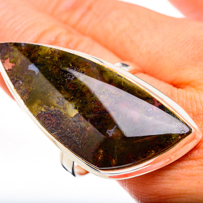 Sterling silver ring close-up of green moss agate teardrop face