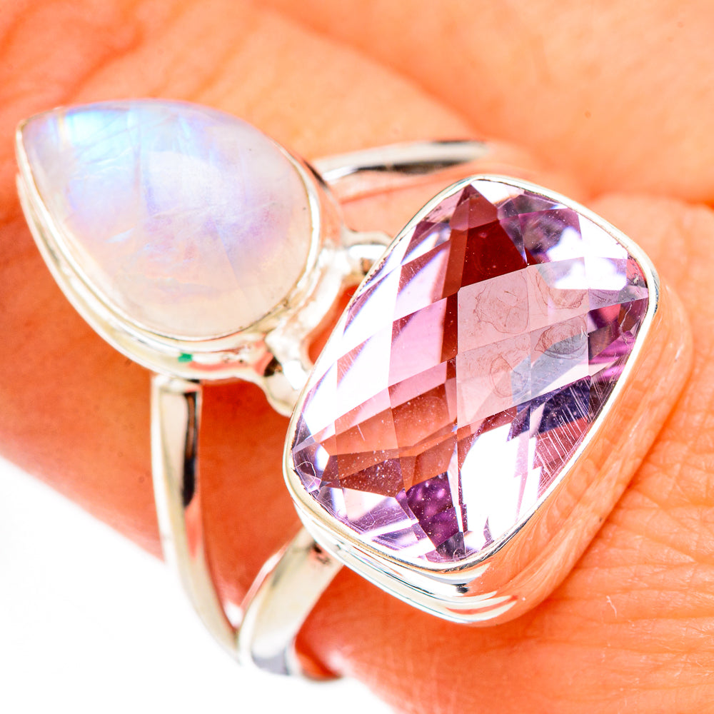 Sterling silver ring close-up with pale opal teardrop and faceted purple amethyst