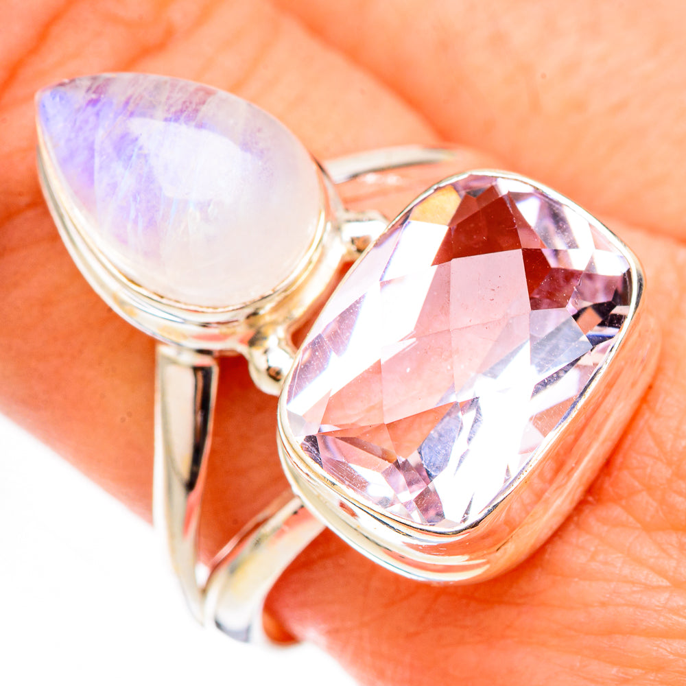 Sterling silver ring with iridescent white teardrop stone and faceted pink-purple gem