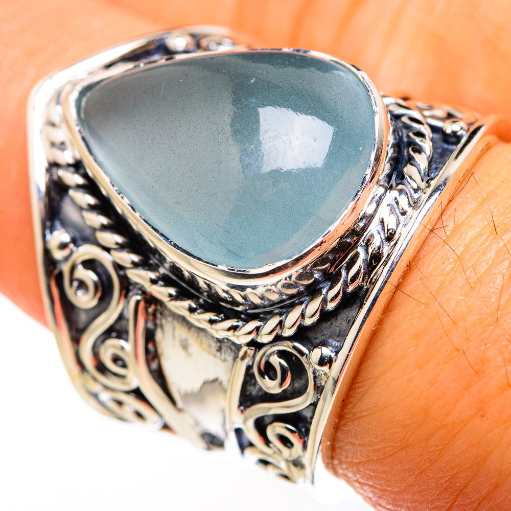 Sterling silver ring with filigree bezel and pear-shaped aquamarine-blue gemstone