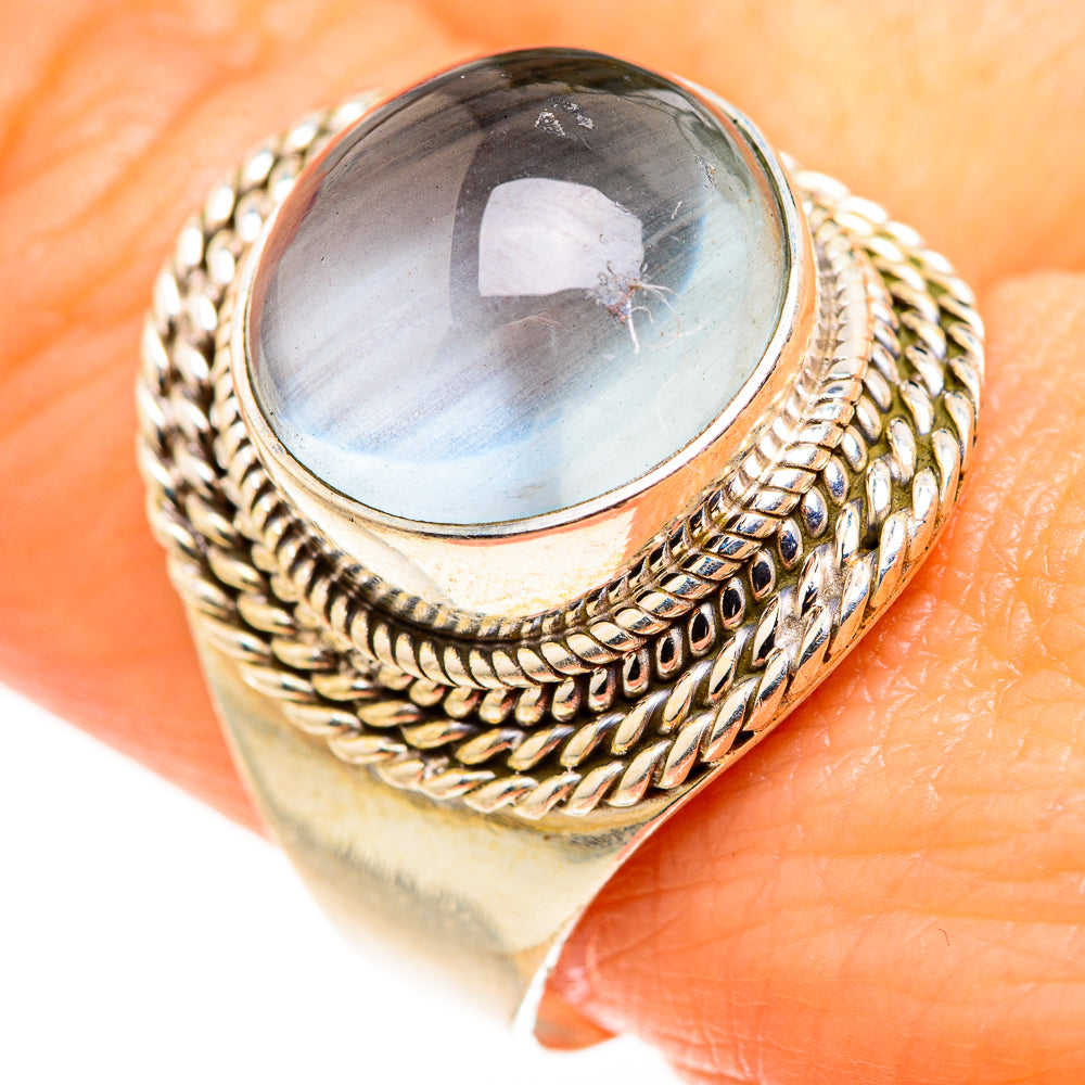Aquamarine gemstone ring, oval light-blue stone in sterling silver, textured band