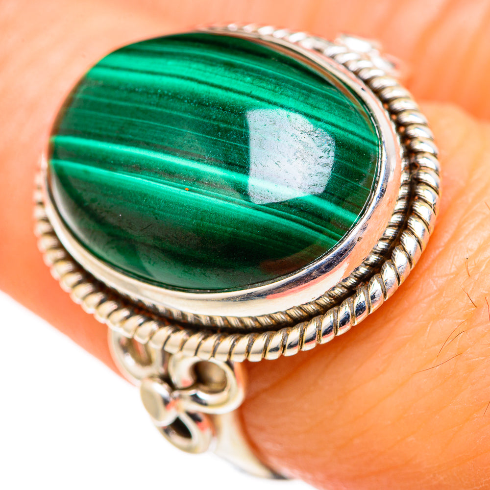 Sterling silver malachite ring featuring oval green malachite cabochon with rope border