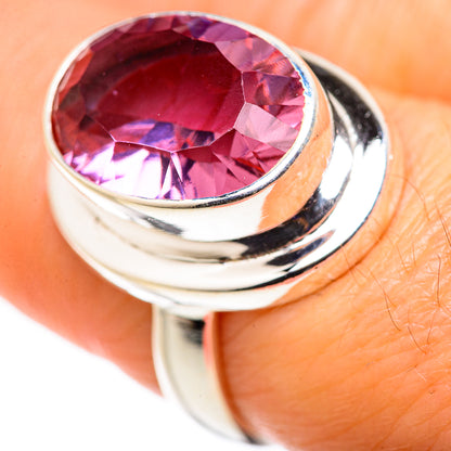 925 sterling silver ring with oval color-change lab alexandrite, pink stone on finger