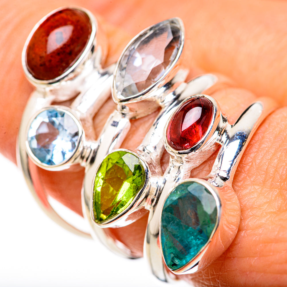 Sterling silver multi-stone ring with blue, green, red and teal oval cabochons on bands