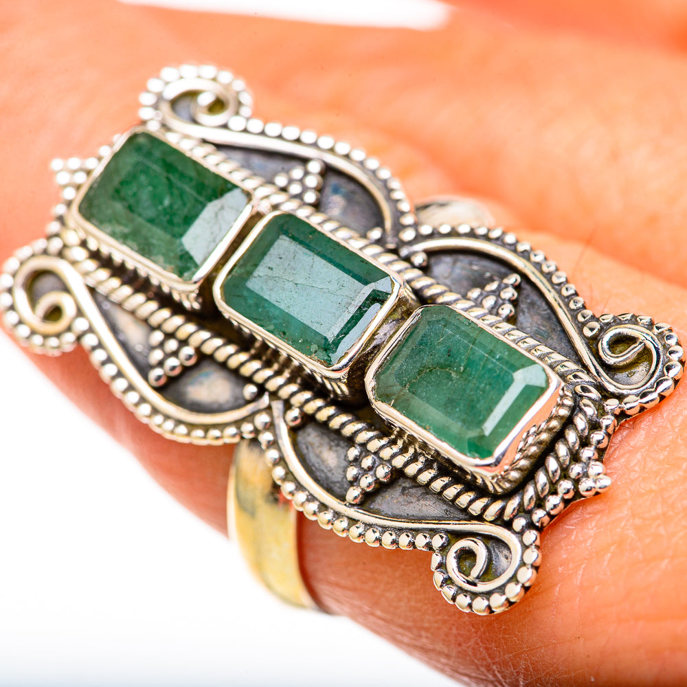 Ornate silver ring with three emerald-green rectangular gemstones and beaded border