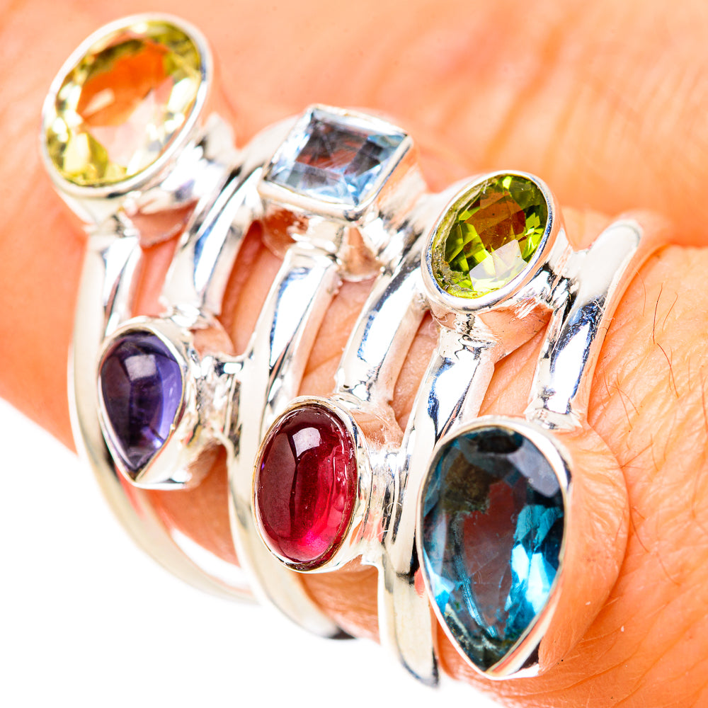 Sterling silver multi-stone ring with oval blue, red, purple, and yellow-green gems