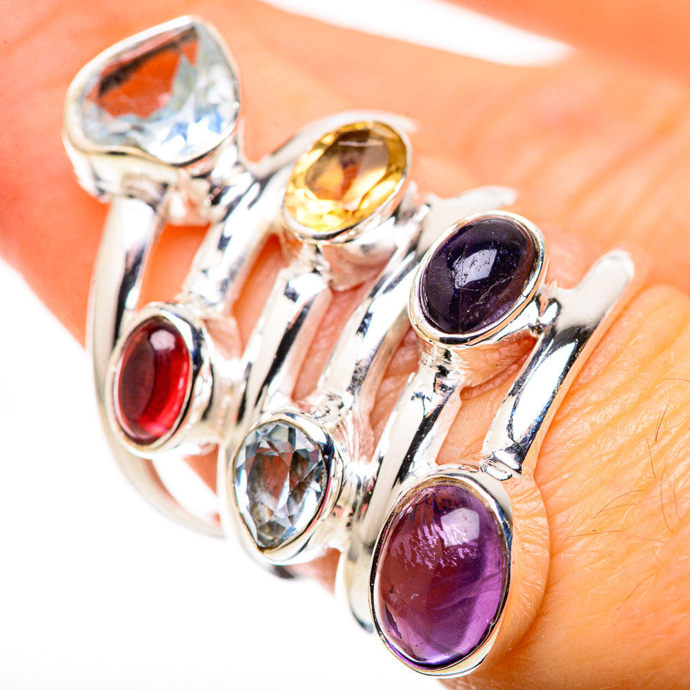 Sterling silver ring with oval purple amethyst and blue topaz, plus red stone