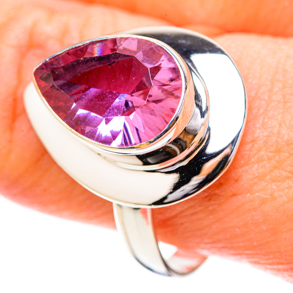 Sterling silver ring with oval pink faceted gemstone in polished prong setting