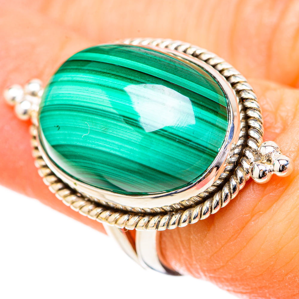 Oval green malachite cabochon ring with twisted rope border and bezel setting