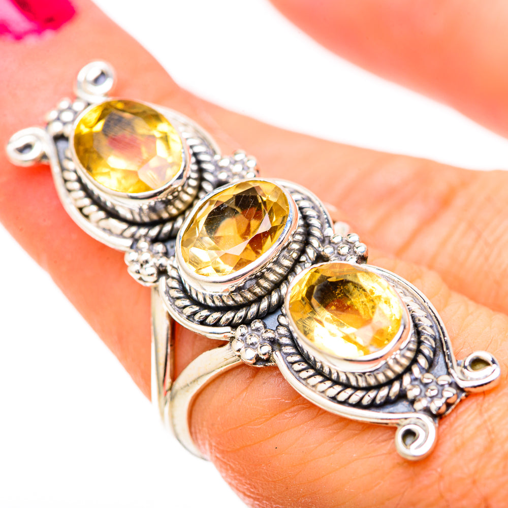 Sterling silver ring with three oval faceted yellow citrine stones in ornate settings