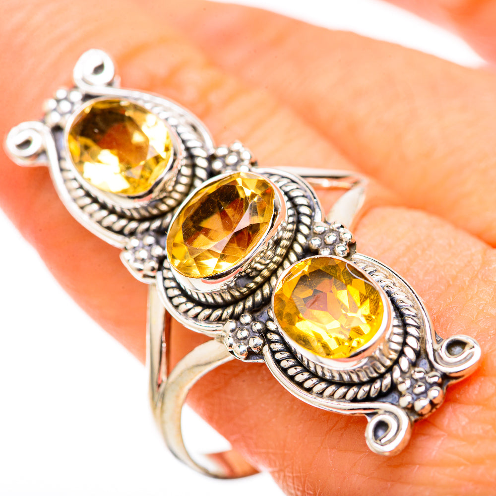 Sterling silver ring with three oval faceted yellow citrine stones, beaded halo settings