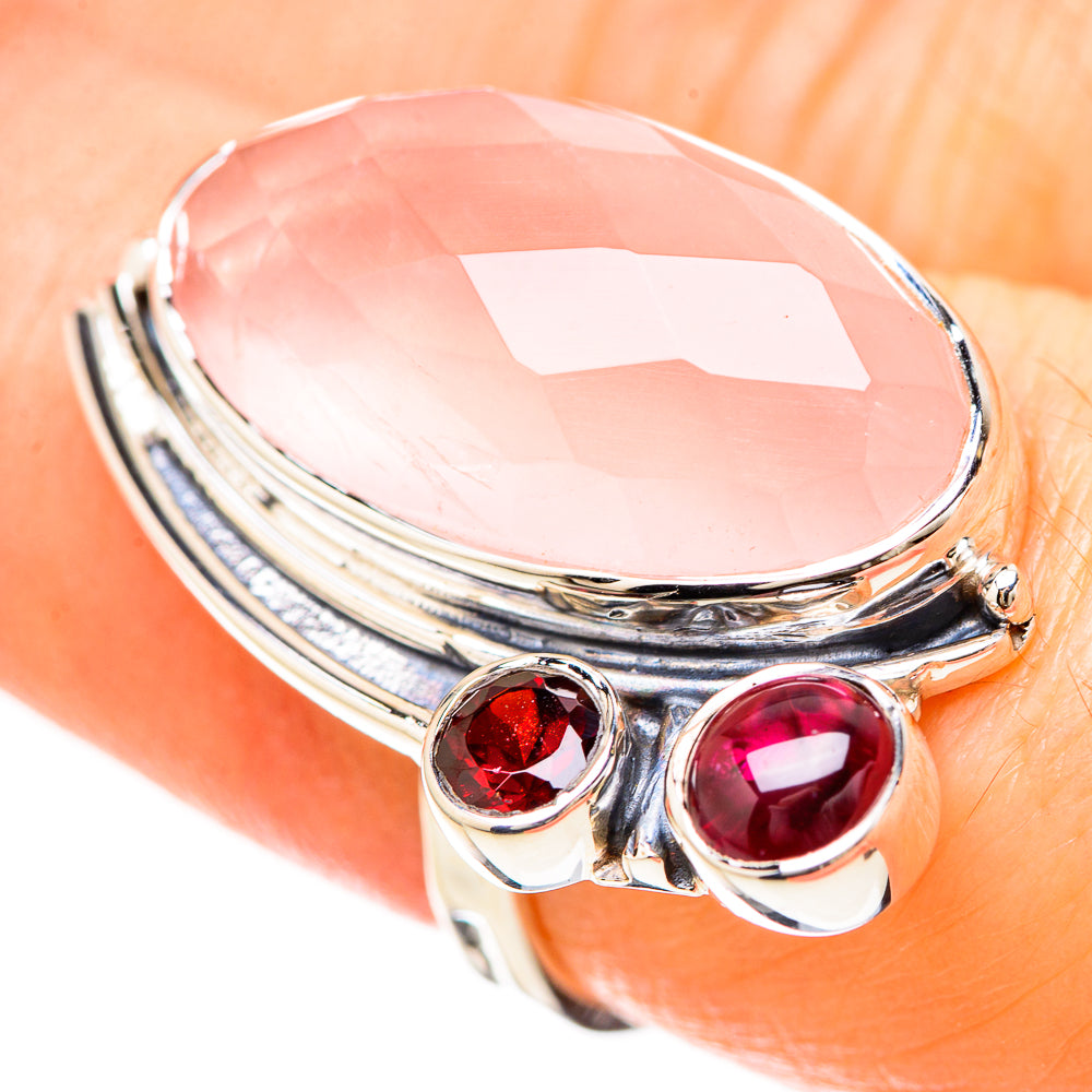 Rose quartz oval top with two bezel-set round red and magenta stones on silver