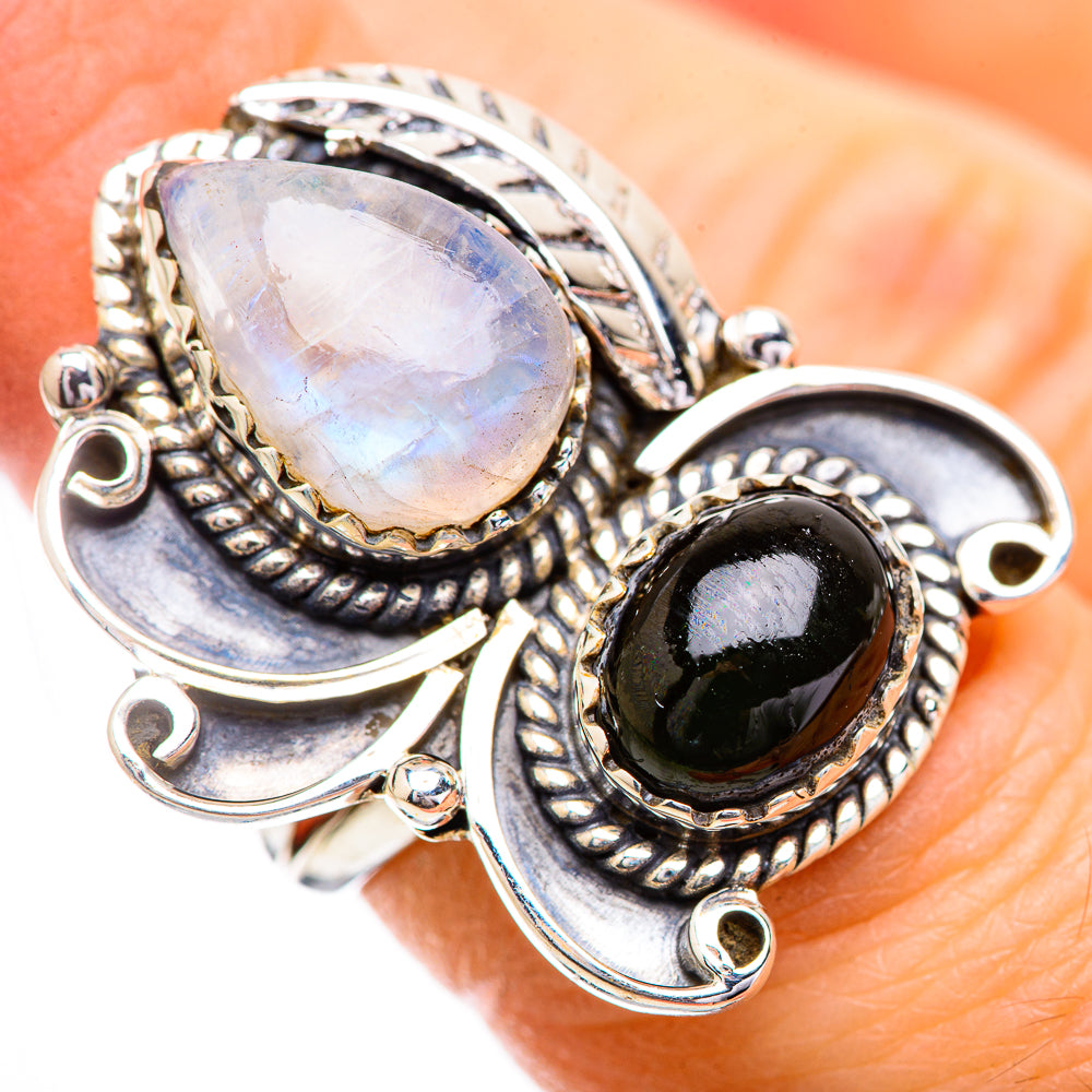Sterling silver ring with moonstone teardrop top and oval dark cabochon accent