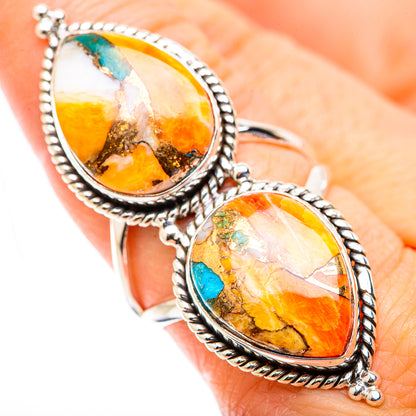 Sterling silver ring with two oval spiny oyster cabochons and bright turquoise accents