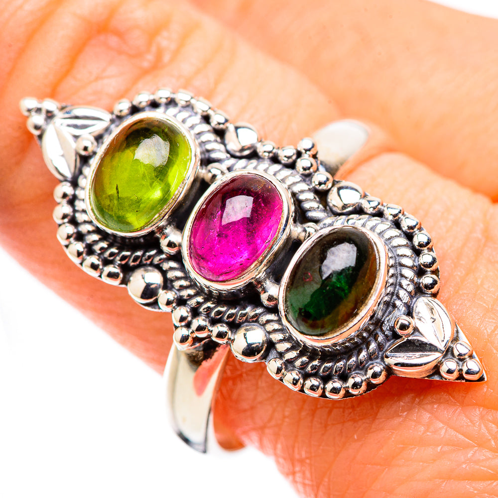 Sterling silver tourmaline ring with green, pink, and dark green oval stones on hand