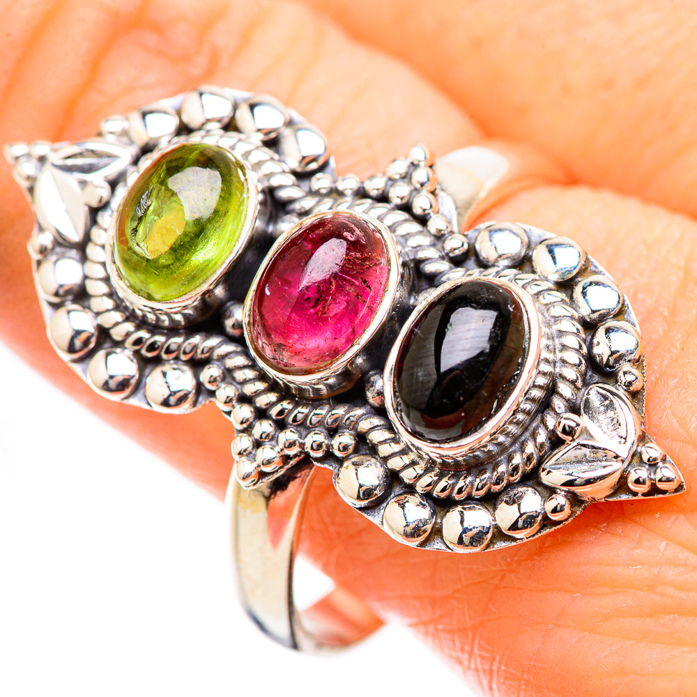 Ornate sterling silver ring with green and pink oval stones and dark center oval, size 11