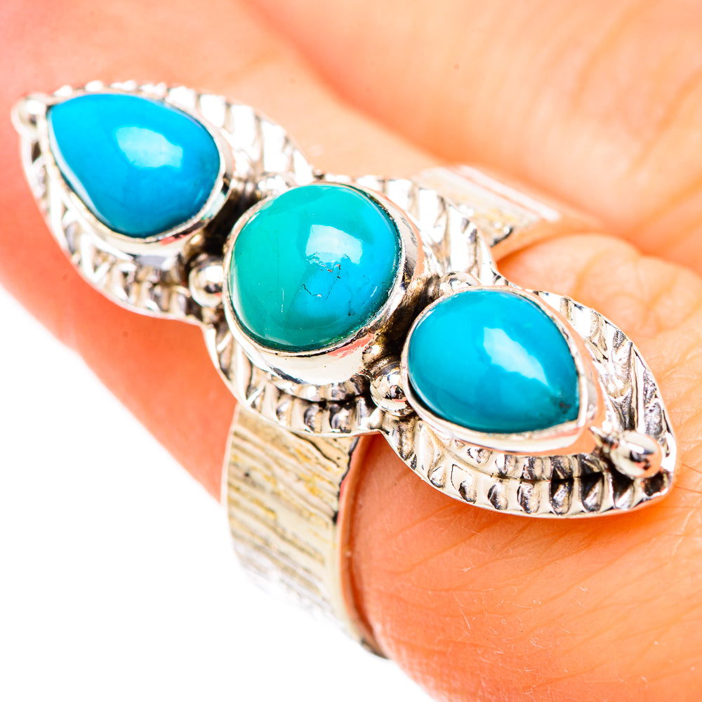Sterling silver ring with three turquoise teardrop cabochons in ornate bezels