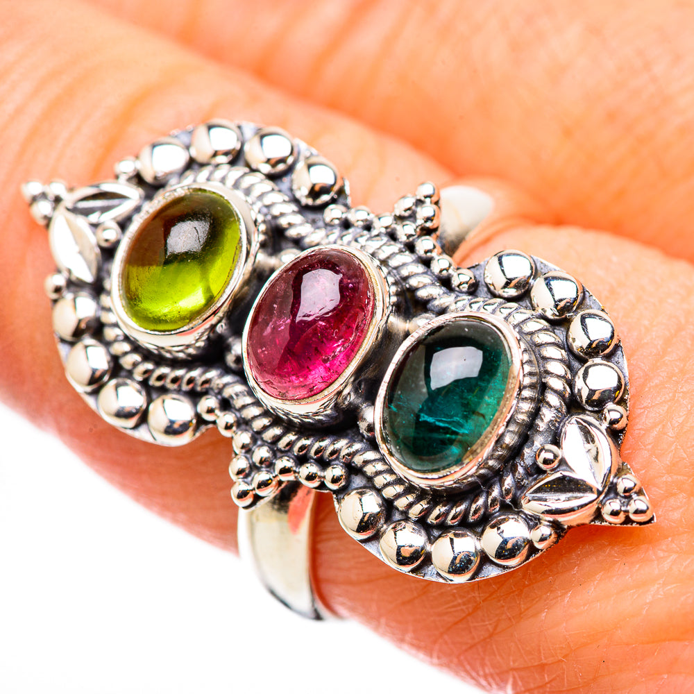 Sterling silver ring with three oval gemstones: lime green, pink, and teal