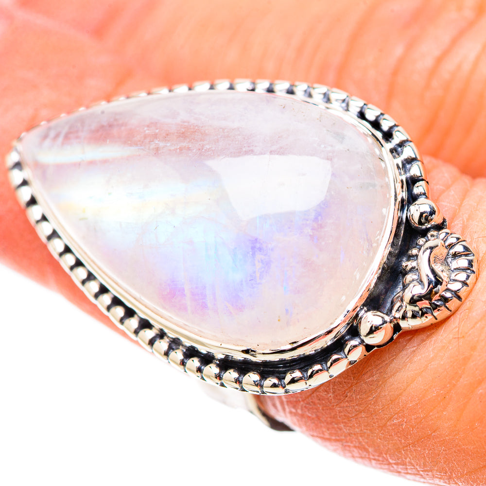 Teardrop rainbow moonstone ring in silver with detailed bezel and scalloped edge