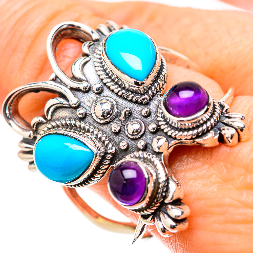 Ornate sterling silver ring with turquoise and amethyst cabochon stones, filigree detail