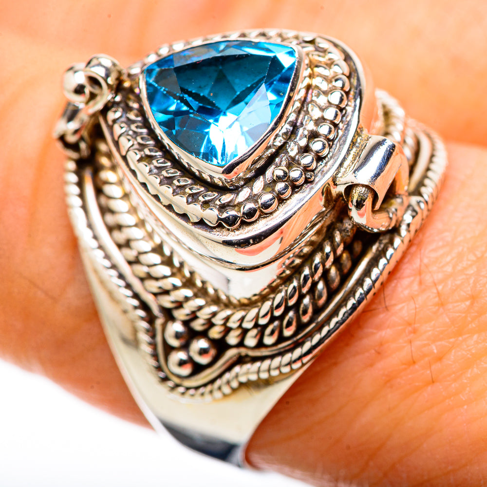 Sterling silver ring with blue topaz pear-cut gemstone and ornate bezel details