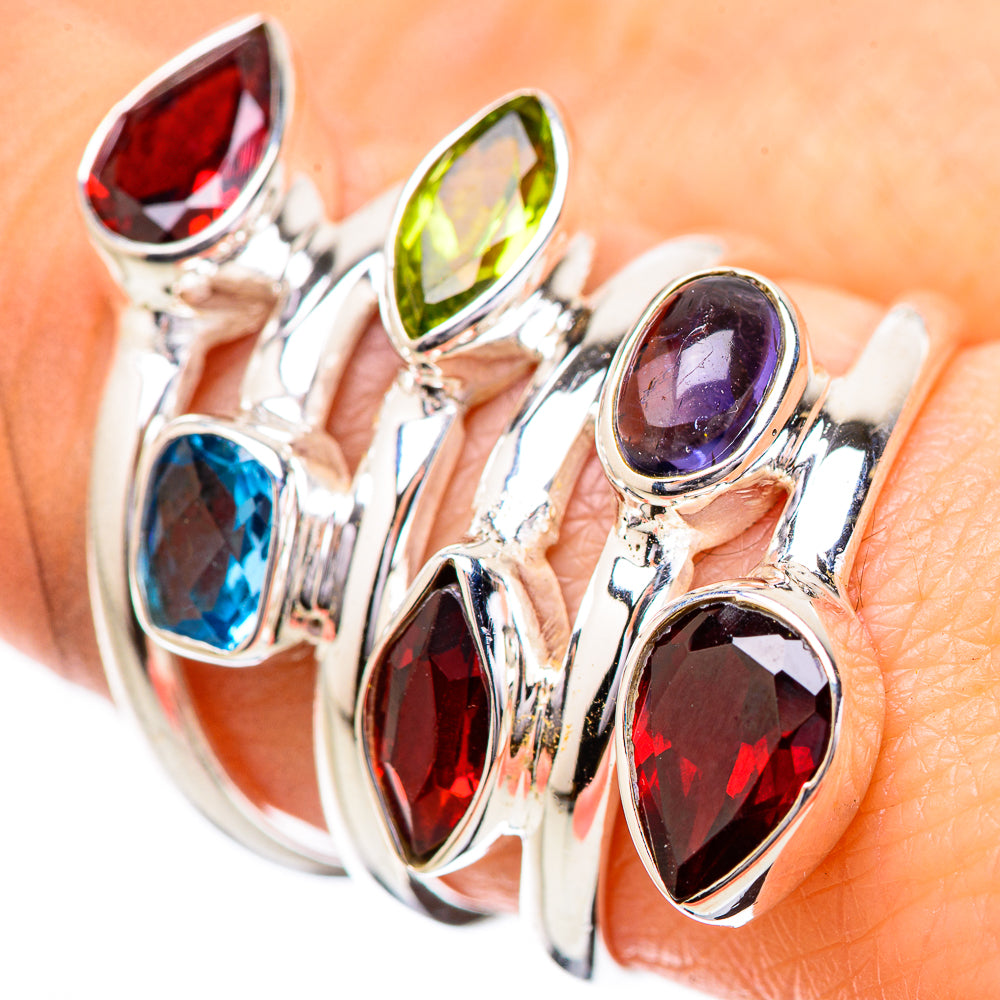 Sterling silver multi-stone ring with oval garnet, blue topaz, peridot, and tanzanite accents