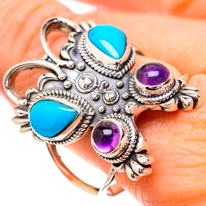 Skull ring with two turquoise teardrop stones and three purple amethyst round stones