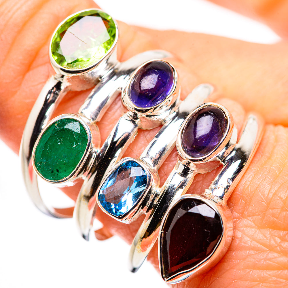 Sterling silver ring with oval green, purple, and blue gemstones on raised settings
