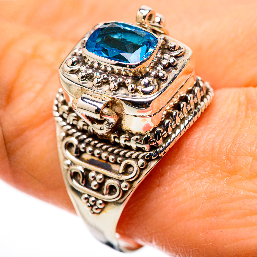 Poison sterling silver ring with large blue topaz oval stone and decorative side scrollwork