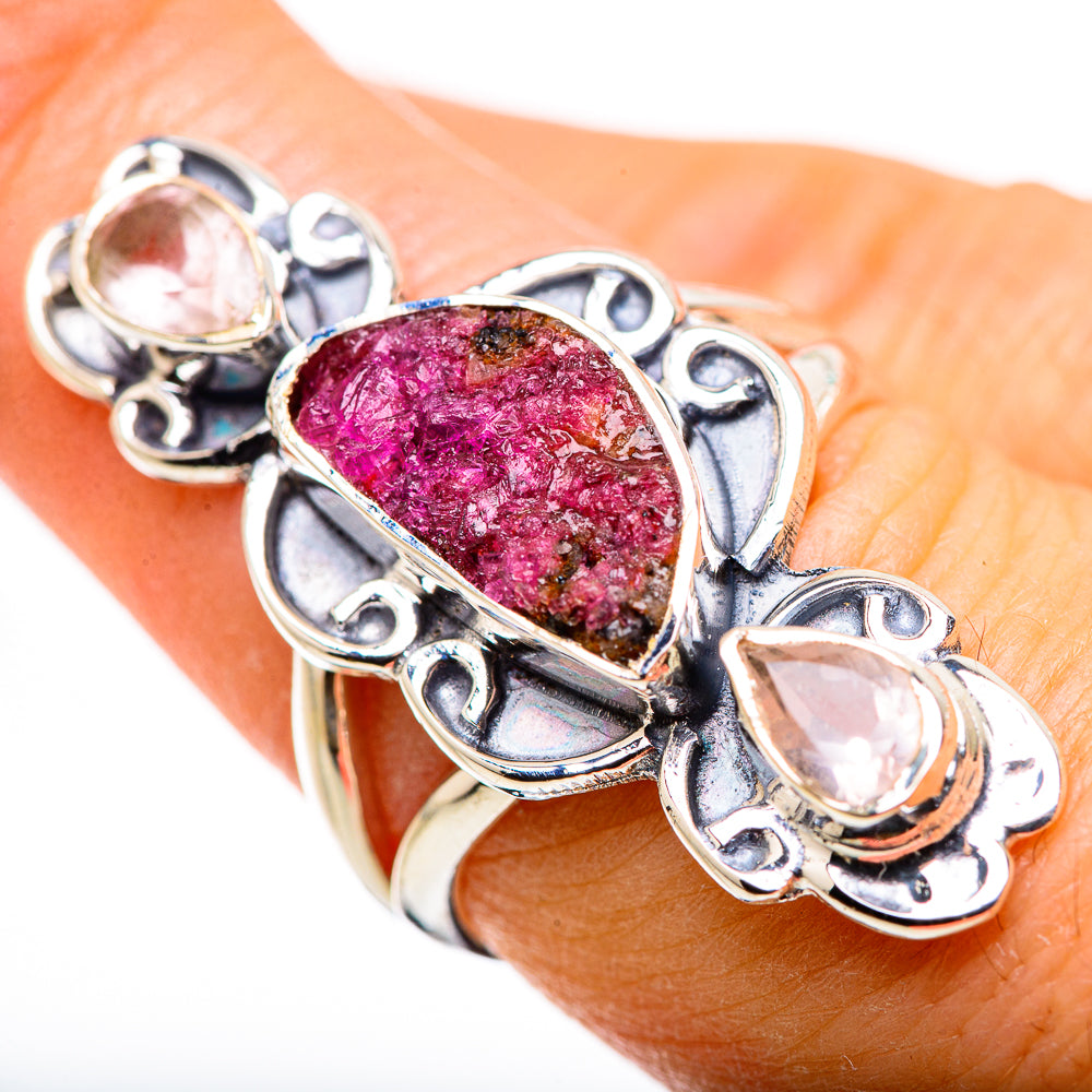 Sterling silver ring with oval pink druzy center stone and pink side gemstones