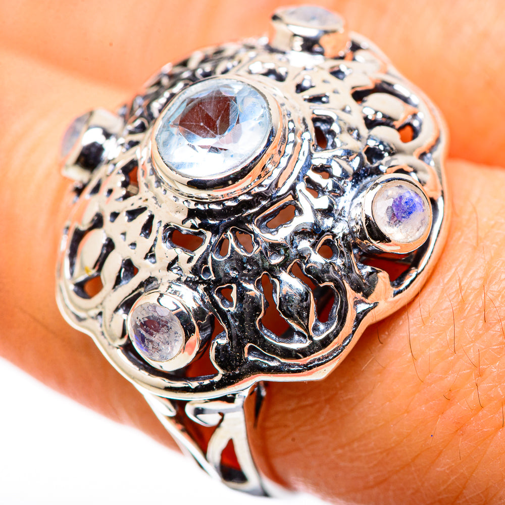 Sterling silver filigree ring with large oval moonstone and small purple-blue stones