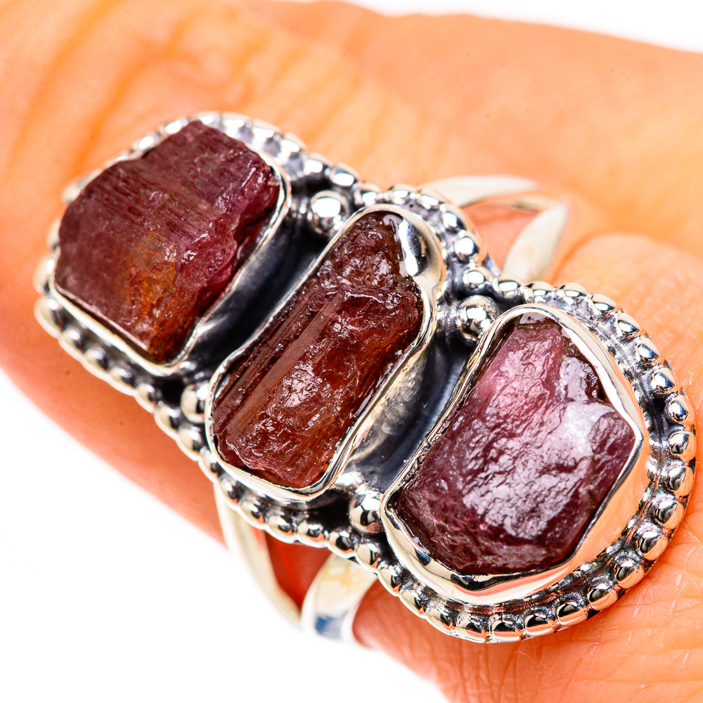 Sterling silver stack ring with three rough rose-pink tourmaline stones on hand