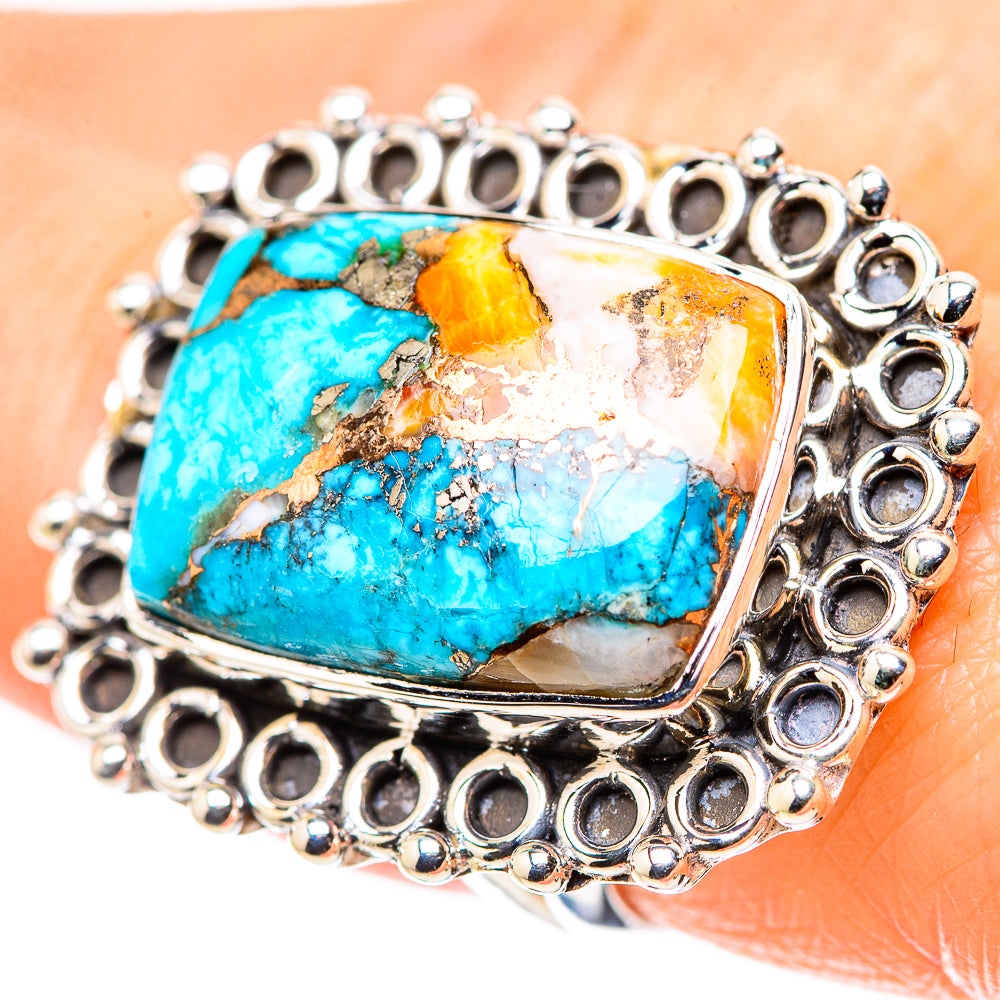 Sterling silver ring with large turquoise spiny oyster cabochon and ornate circular bezel