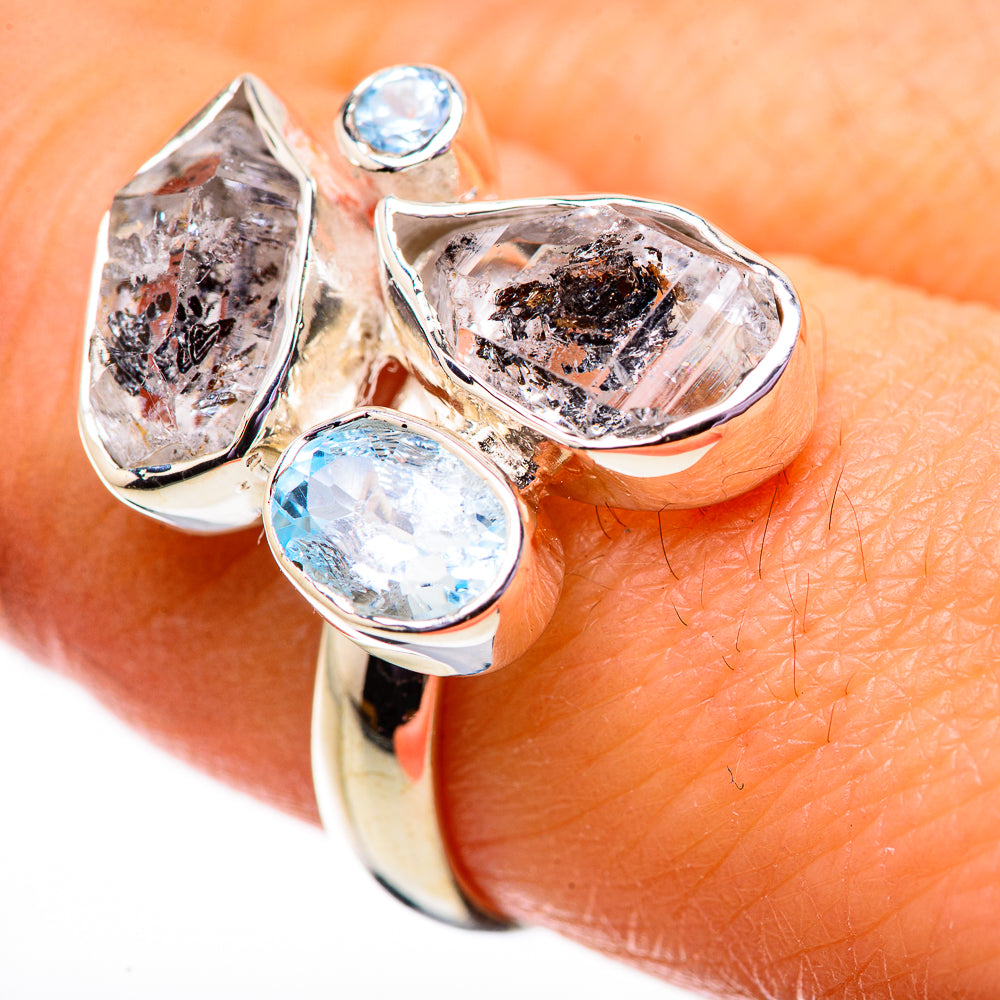 Sterling silver ring with three light-blue topaz and clear herkimer diamond-style stones