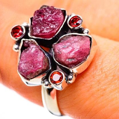 Sterling silver statement ring with three rough pink stones and red garnet highlights
