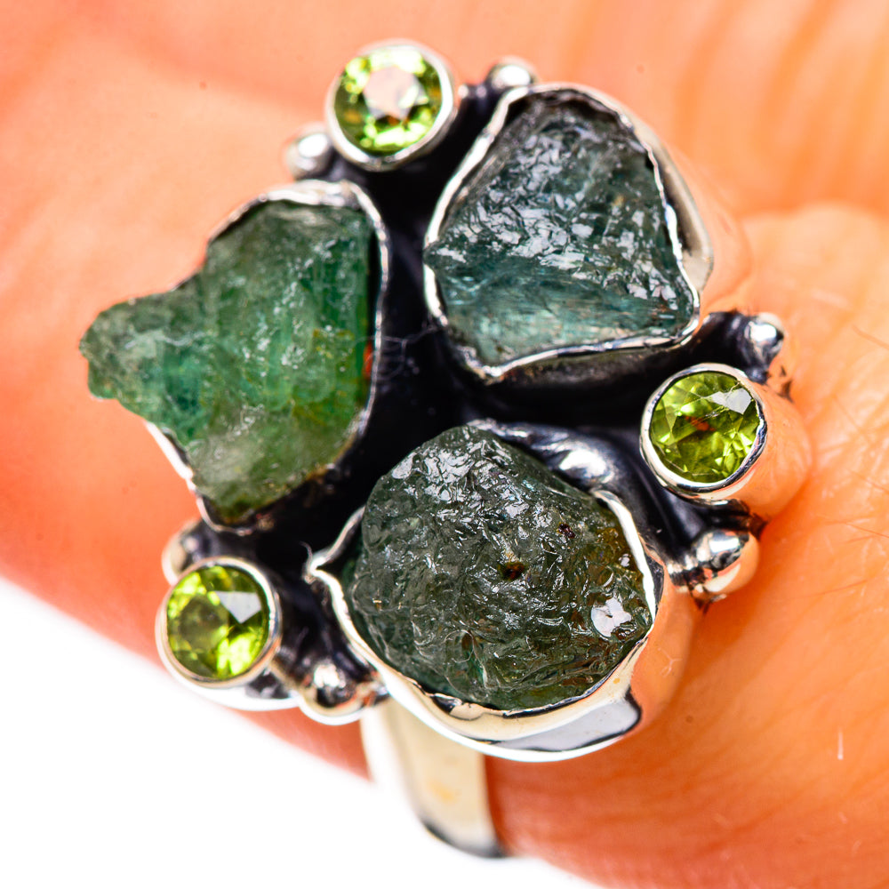 Sterling silver ring with four rough green gemstones and small round green stones