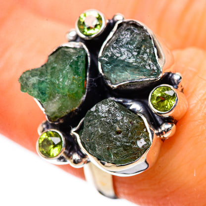 Sterling silver ring with four rough green gemstones and small round green stones