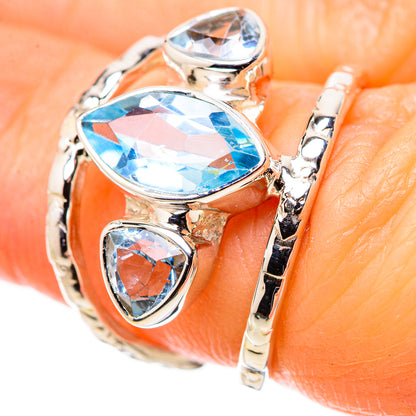 Sterling silver ring with oval blue topaz center and marquise side stones