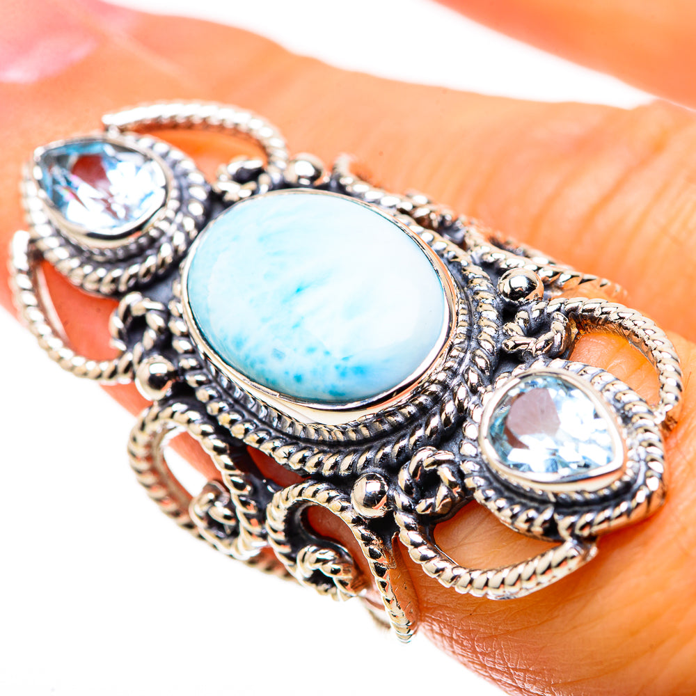 925 sterling silver ring with oval turquoise cabochon and blue oval accents in filigree setting
