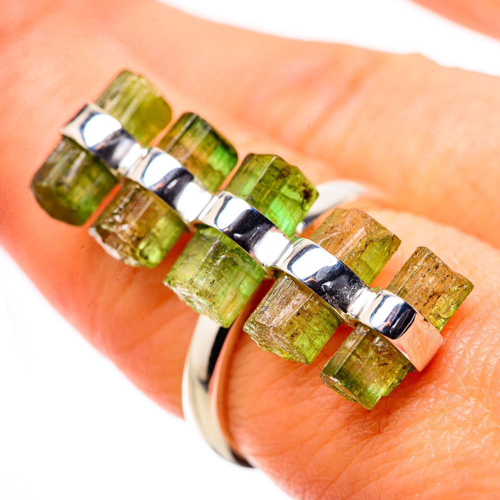 Sterling silver ring with green tourmaline baguette stones in a crisscross setting