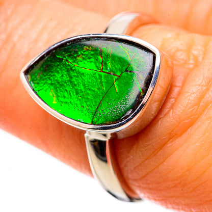Polished sterling silver ring with green iridescent ammolite gemstone