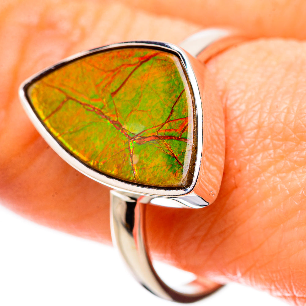 Sterling silver ammolite teardrop ring with green gemstone in bezel setting