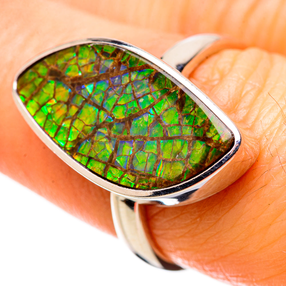 Sterling silver ammolite ring with green iridescent oval gemstone in bezel setting